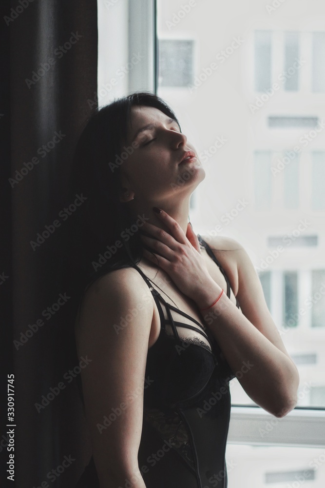 Attractive caucasian brunette girl at home, emotional portrait