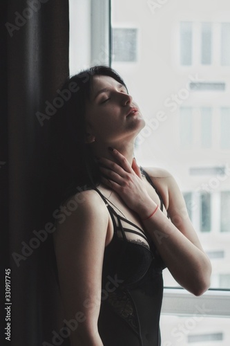 Attractive caucasian brunette girl at home, emotional portrait