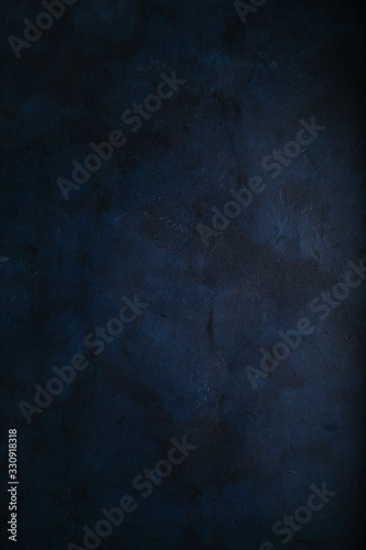 Abstract grunge dark navy blue background, textured. Copyspace.