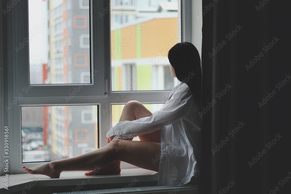 Attractive caucasian brunette girl at home, emotional portrait