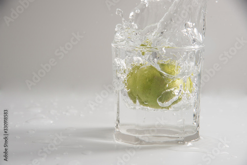 glass of water with ice and lemon