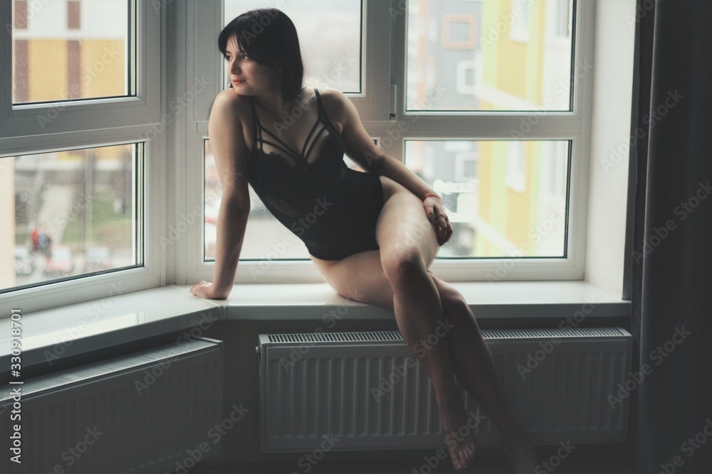 Attractive caucasian brunette girl at home, emotional portrait