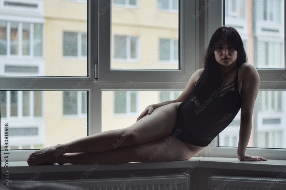 Attractive caucasian brunette girl at home, emotional portrait