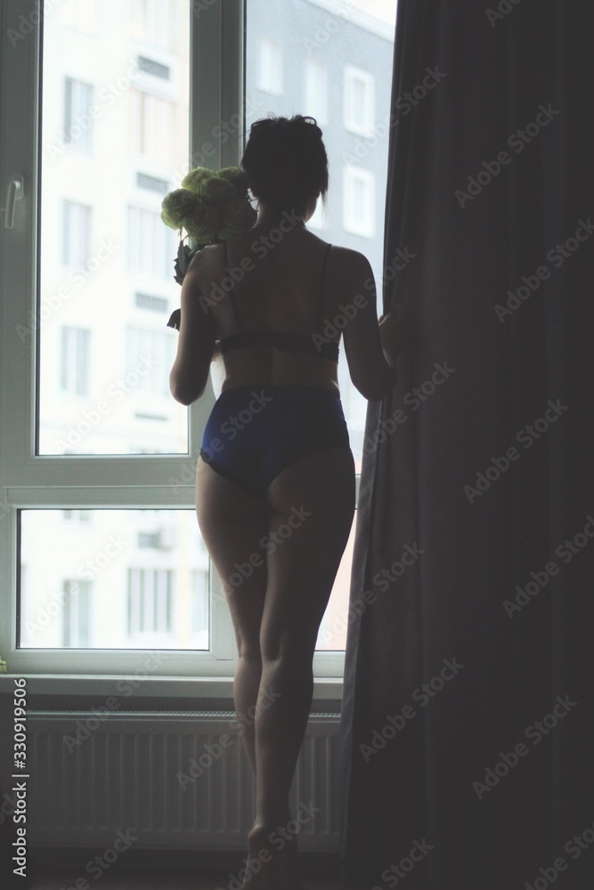 Attractive caucasian brunette girl at home, emotional portrait