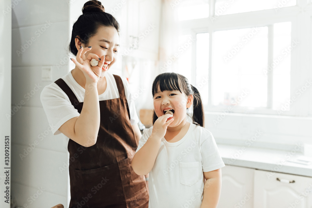 The family is baking bread in the kitchen The family is baking bread in the kitchen