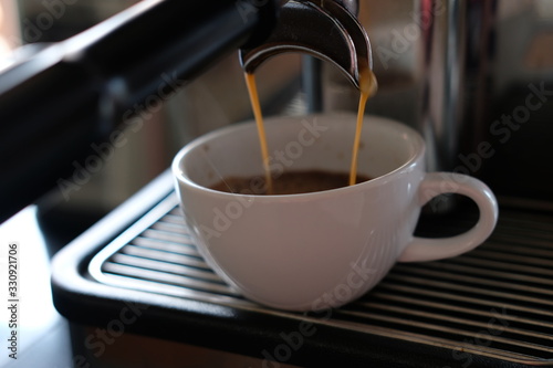 Barista make coffee with coffee machine background