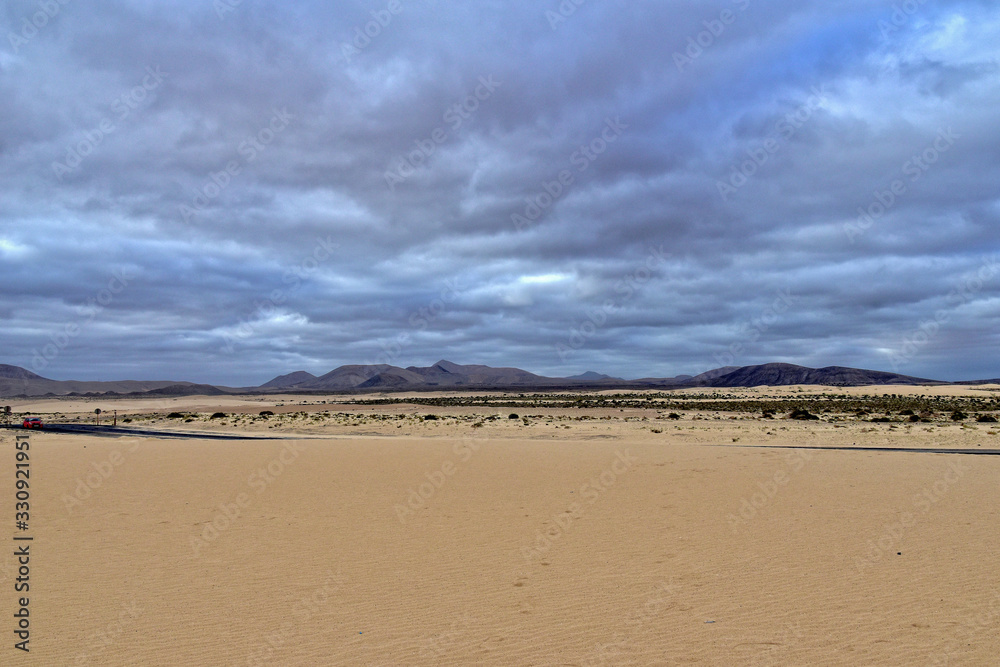 landscape from the Spanish Canary Island Fuerteventura with dunes and the ocean
