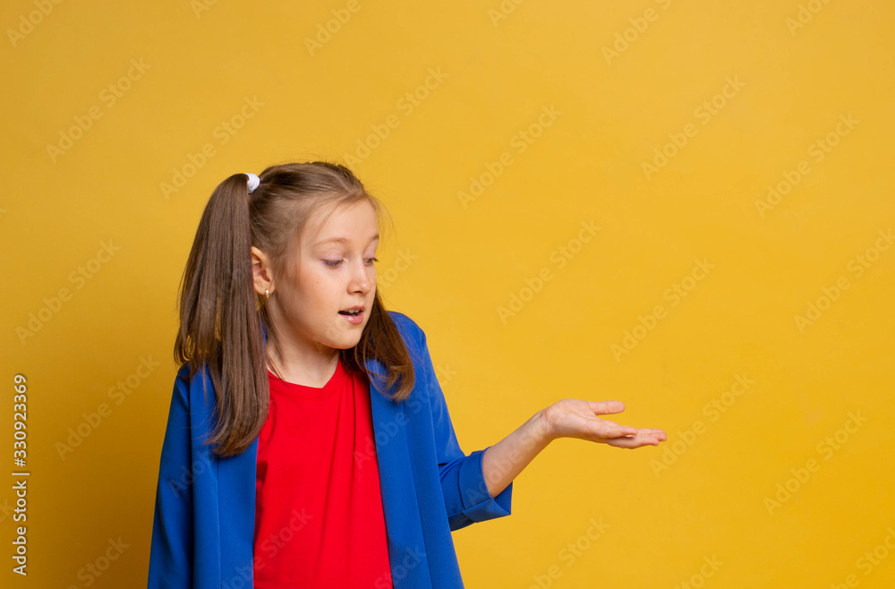 Portrait attractive girl impressed astonished gesture hand wear red t-shirt and blu jacket on yellow background Portrait attractive girl impressed astonished gesture hand wear red t-shirt and blu jacket on yellow background