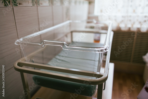 New born hospital bed. Empty bed of a newborn in the hospital.