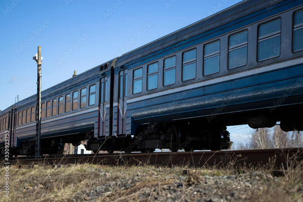 A commuter train moves on rails.