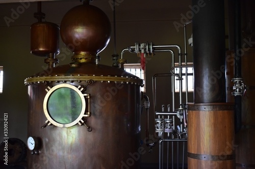 Alcohol distillation equipment, vintage copper tank with gauge.
