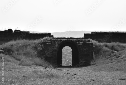 black and white image of Entry gate of chapora fort