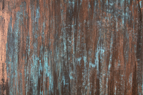 The texture of the copper background is covered with a patina photo