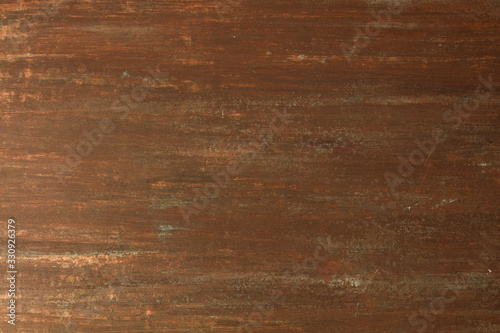 The texture of the copper background is covered with a patina