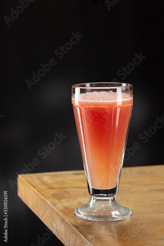 Wallpaper Mural Fresh grapefruit juice in glass. Macro. Selective focus Torontodigital.ca