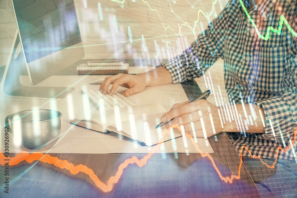 Double exposure of stock market chart with man working on computer on background. Concept of financial analysis.