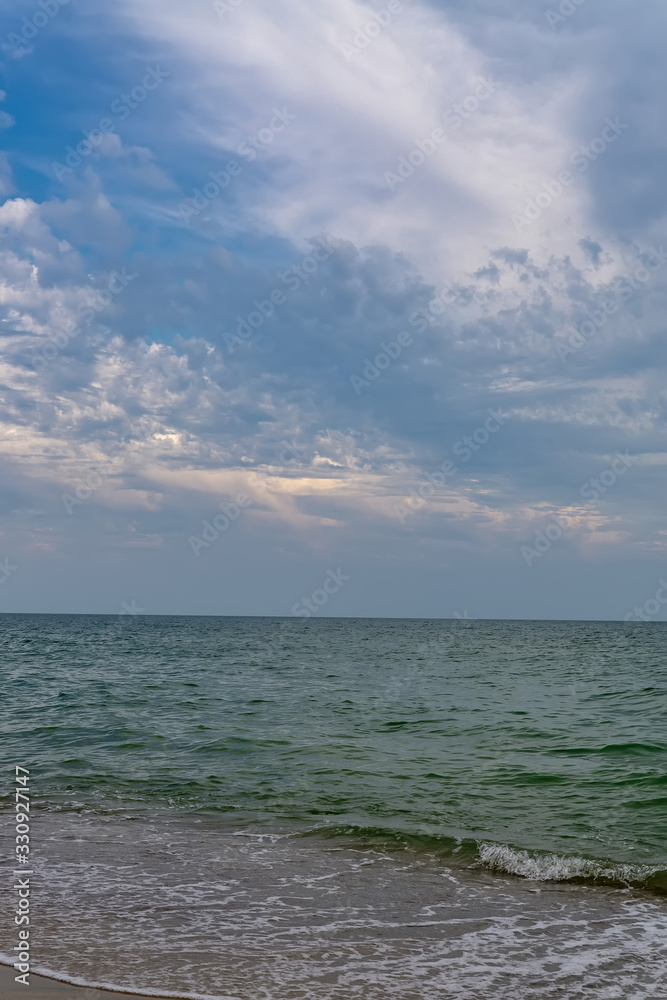Relaxing seascape with wide horizon of the sky and the sea