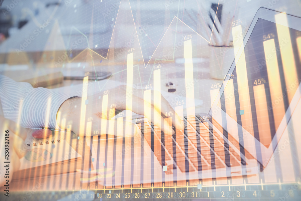 Double exposure of stock market graph with man working on laptop on background. Concept of financial analysis. Double exposure of stock market graph with man working on laptop on background. Concept of financial analysis.