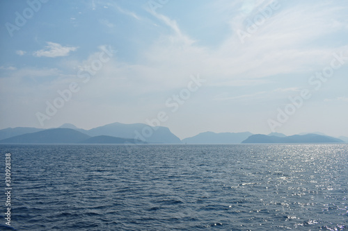 silhouettes of mountains on the Aegean sea.