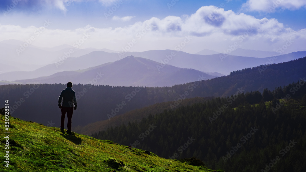 Man hiker on a top of a mountain , Aiako Harriak natural park, Euskadi