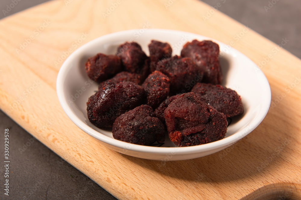 Homemade plum snacks on a small white plate