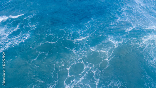 Top view of blue waves with natural water texture background