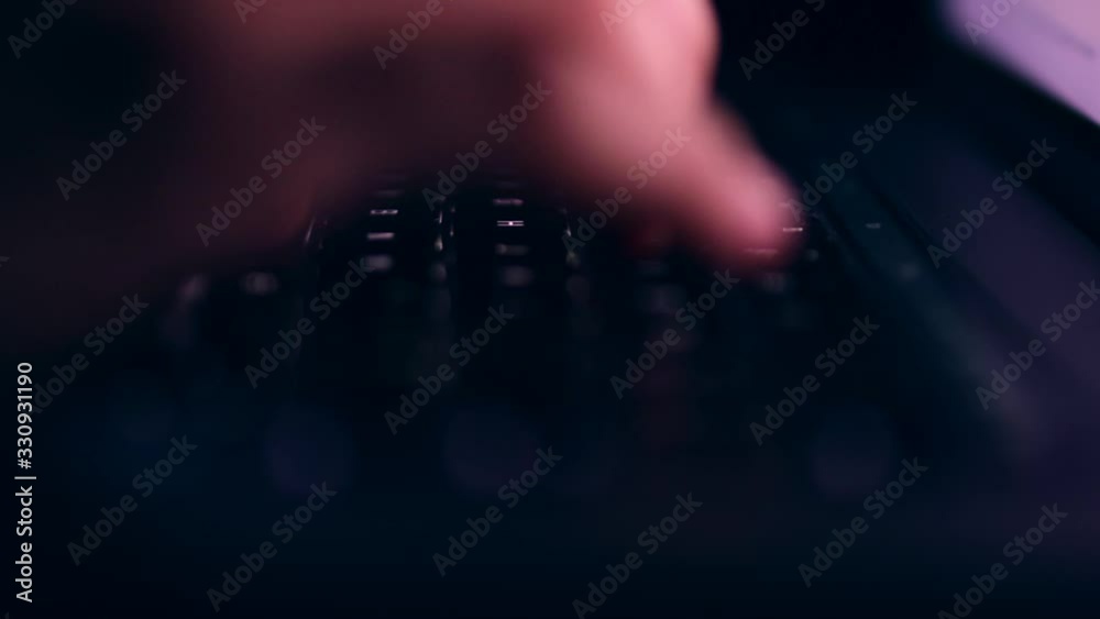 close insert of a person typing and laptops keyboard , searching and exploring the internet on a shallow depth of field shot. close insert of a person typing and laptops keyboard , searching and exploring the internet on a shallow depth of field shot.