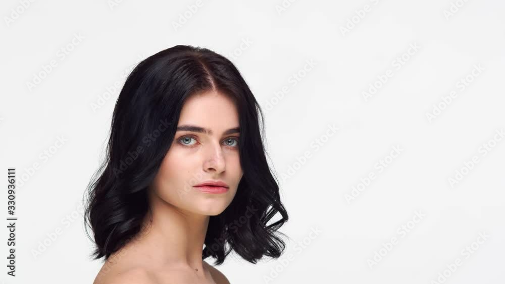 Studio portrait of young and beautiful brunette woman over isolated white background. Skin care, health, makeup and cosmetics. Studio portrait of young and beautiful brunette woman over isolated white background. Skin care, health, makeup and cosmetics.