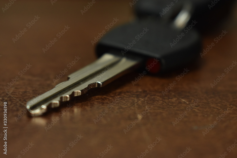 car key on a wooden table