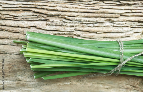 Lemon Grass (Cymbopogon citratus, Capim Limao, Santo). Pile of fresh Lemongrass. Sprigs of natural lemongrass, fresh herb, herbal medicine. Selective focus, closeup