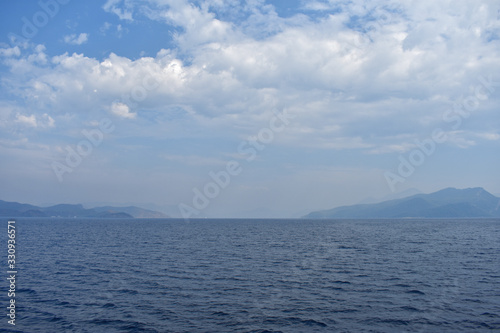 silhouettes of mountains on the Aegean sea.