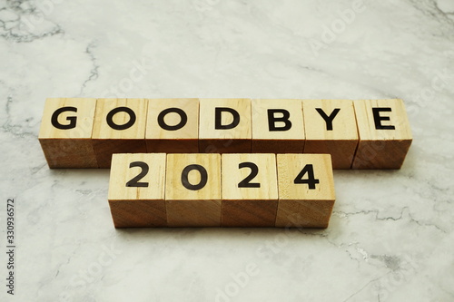Goodbye 2024 alphabet letters on marble background