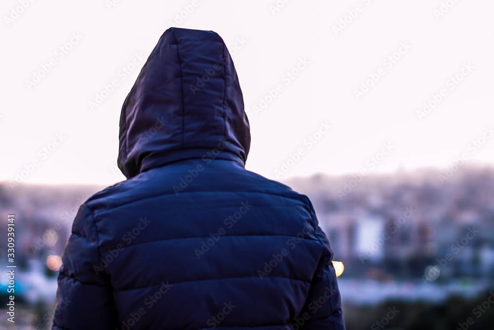 Moody portrait with Tehran skyline at the background. Alone man looking at cityscape of Tehran-Iran at the sunset. Moody portrait with Tehran skyline at the background. Alone man looking at cityscape of Tehran-Iran at the sunset.