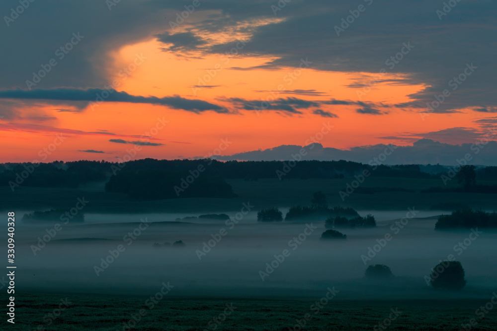 Evening fog over the fields. Agricultural landscape in eastern Lithuania.