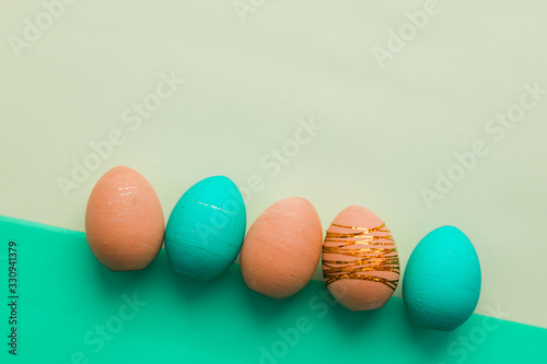 Colorful Easter eggs on a colored background. Concept of a religious holiday.
