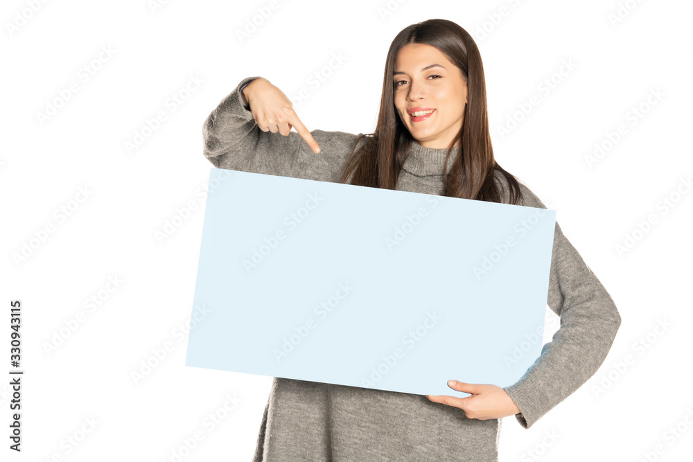 young beautiful happy woman holding a blue empty board young beautiful happy woman holding a blue empty board