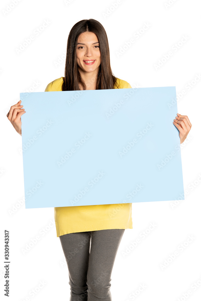 young beautiful happy woman holding a blue empty board young beautiful happy woman holding a blue empty board