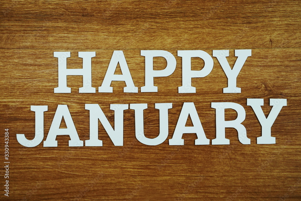Happy January alphabet letter with space copy on woden background Happy January alphabet letter with space copy on woden background