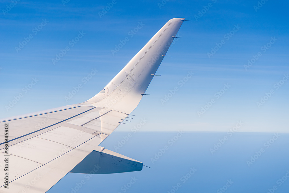 Fototapeta premium Aerial view wing of airplane from window seat.