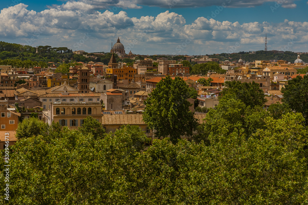 Summer cityscape of the historic center of Rome with a view of roofs and churches