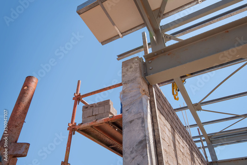 detail view of steel i-beam connecting to concrete wall