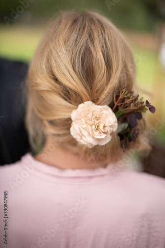Flowers in a blond girls hair
