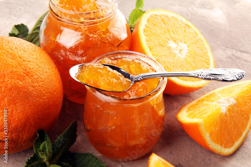 orange homemade jam marmelade in a glass jar. orange marmelade photo