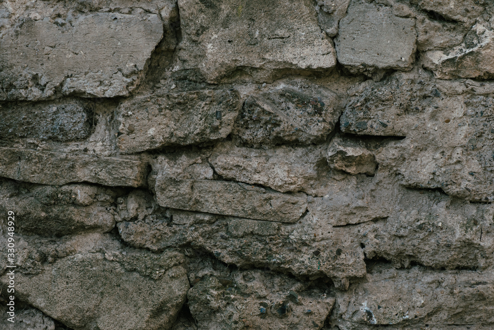 old wall built of natural stone background texture
