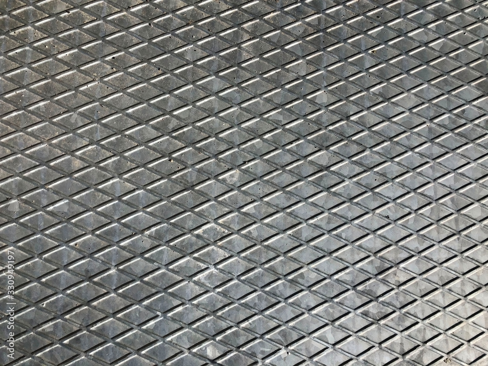 Grey metal background with lines in lattice form. Copy space Grey metal background with lines in lattice form. Copy space