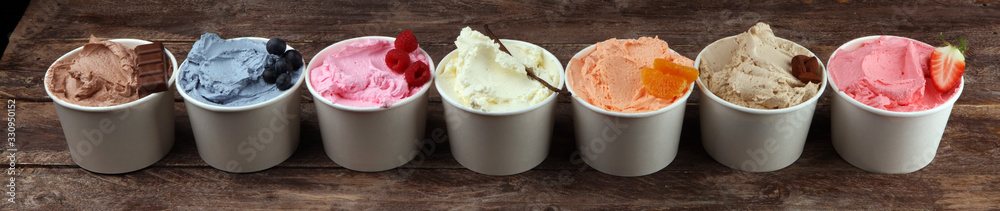 Various of ice cream flavor with fresh blueberry, strawberry, almond, chocolate, vanilla setup on rustic background . Summer and Sweet cold ice cream Various of ice cream flavor with fresh blueberry, strawberry, almond, chocolate, vanilla setup on rustic background . Summer and Sweet cold ice cream