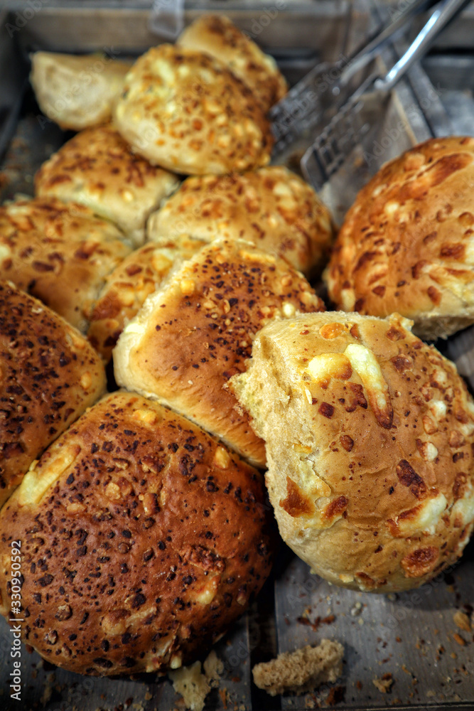 Cheese and pickle bread rolls on a wooden tray Cheese and pickle bread rolls on a wooden tray