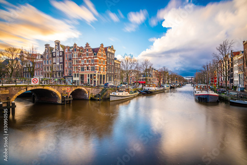 Amsterdam, Netherlands famous canals and bridges at dusk.