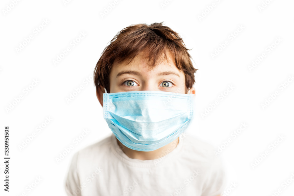 Child in blue medical mask on face. Prevention on first place. Coronavirus protection. Girl with face in mask. Children and illness. Medical care. Illness covid-2019 prevention. Child in blue medical mask on face. Prevention on first place. Coronavirus protection. Girl with face in mask. Children and illness. Medical care. Illness covid-2019 prevention.
