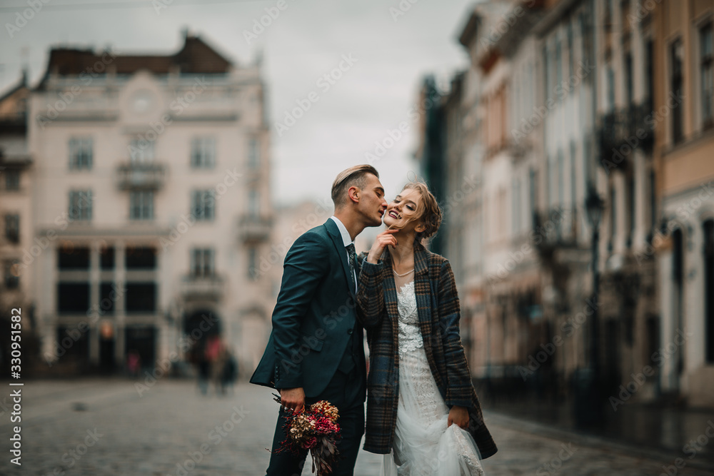 wedding couple walks the streets of Lviv